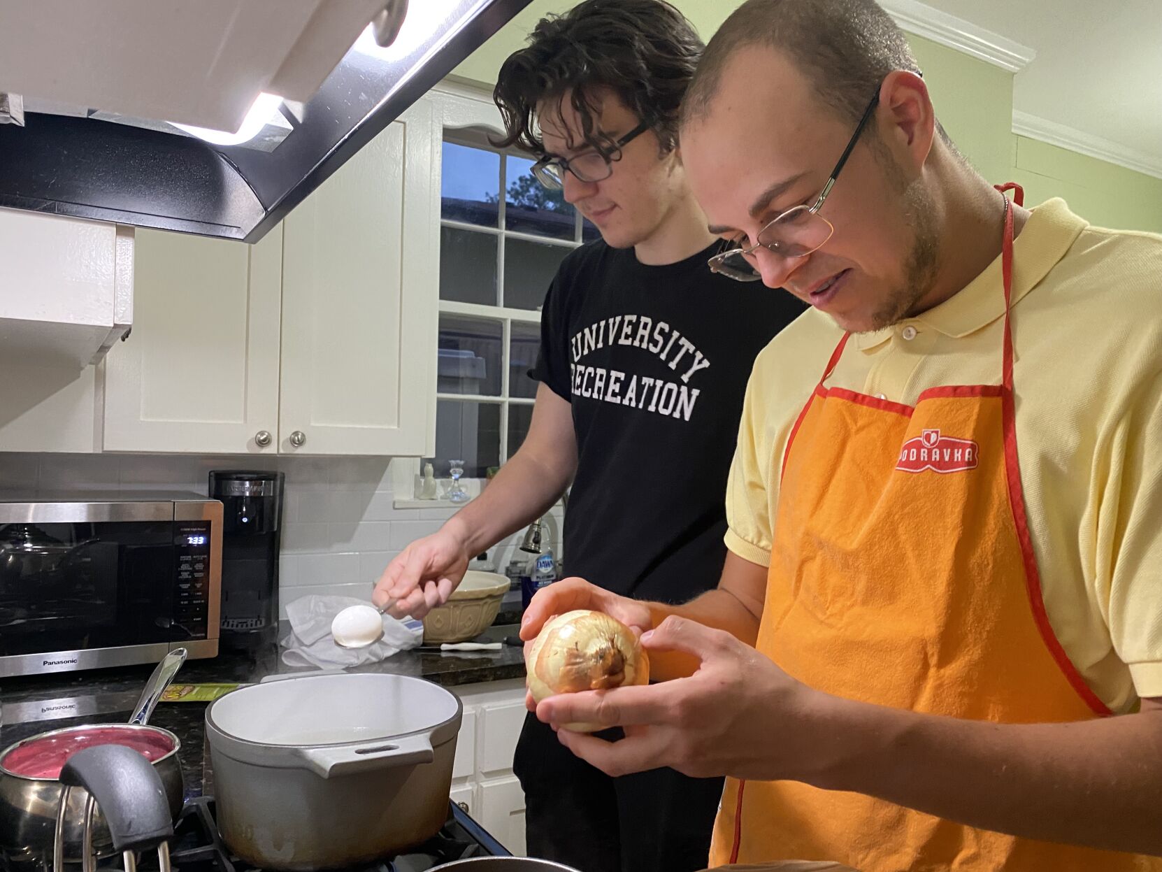 Matvii Cheked and Georgii Ageenkov prepare Easter eggs